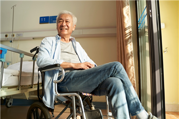 Image of man looking happy in care home