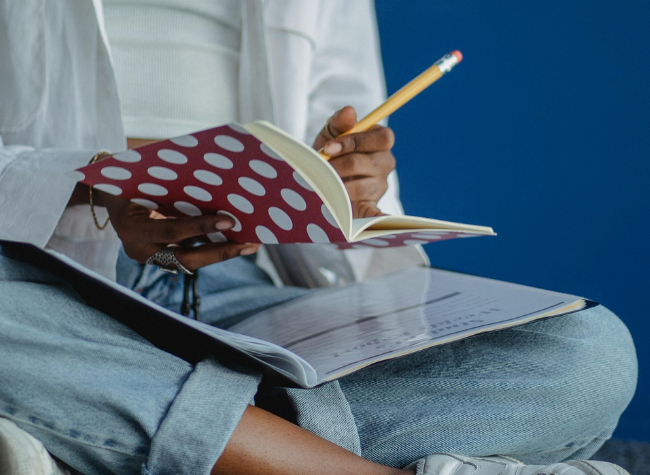 person filling in workbook