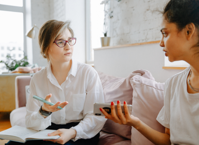 professional and adult sitting talking 