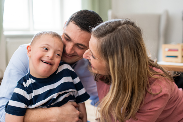 Parents with their down-syndrome child