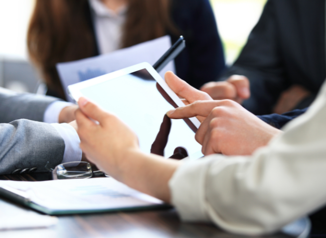 group of people sitting at desk planning